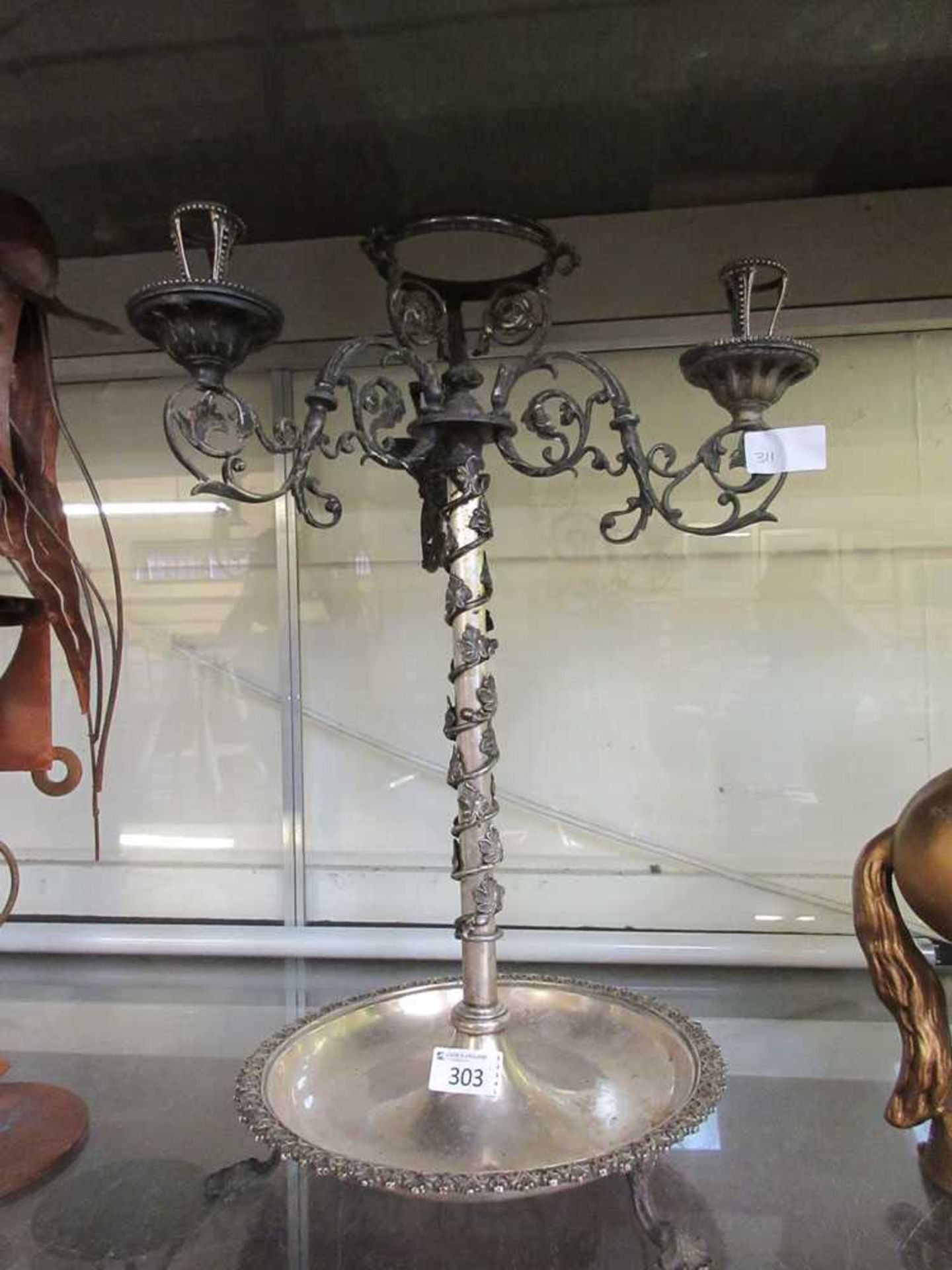 A silver plated three branch candelabra