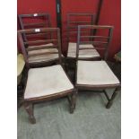 A set of four oak framed early 20th century dining chairs