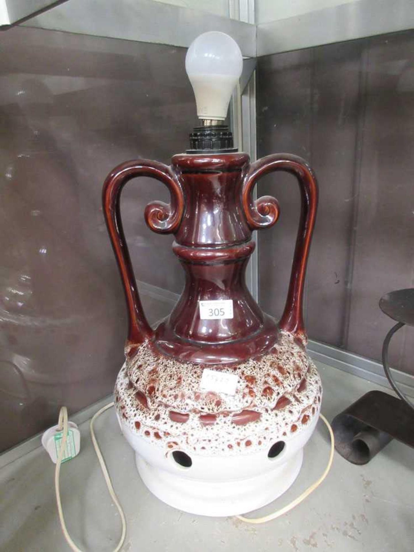 A mid-20th century brown glazed table lamp