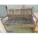 A slatted teak garden bench Dimensions: H, 87cm , W, 124cm , D, 61cm.