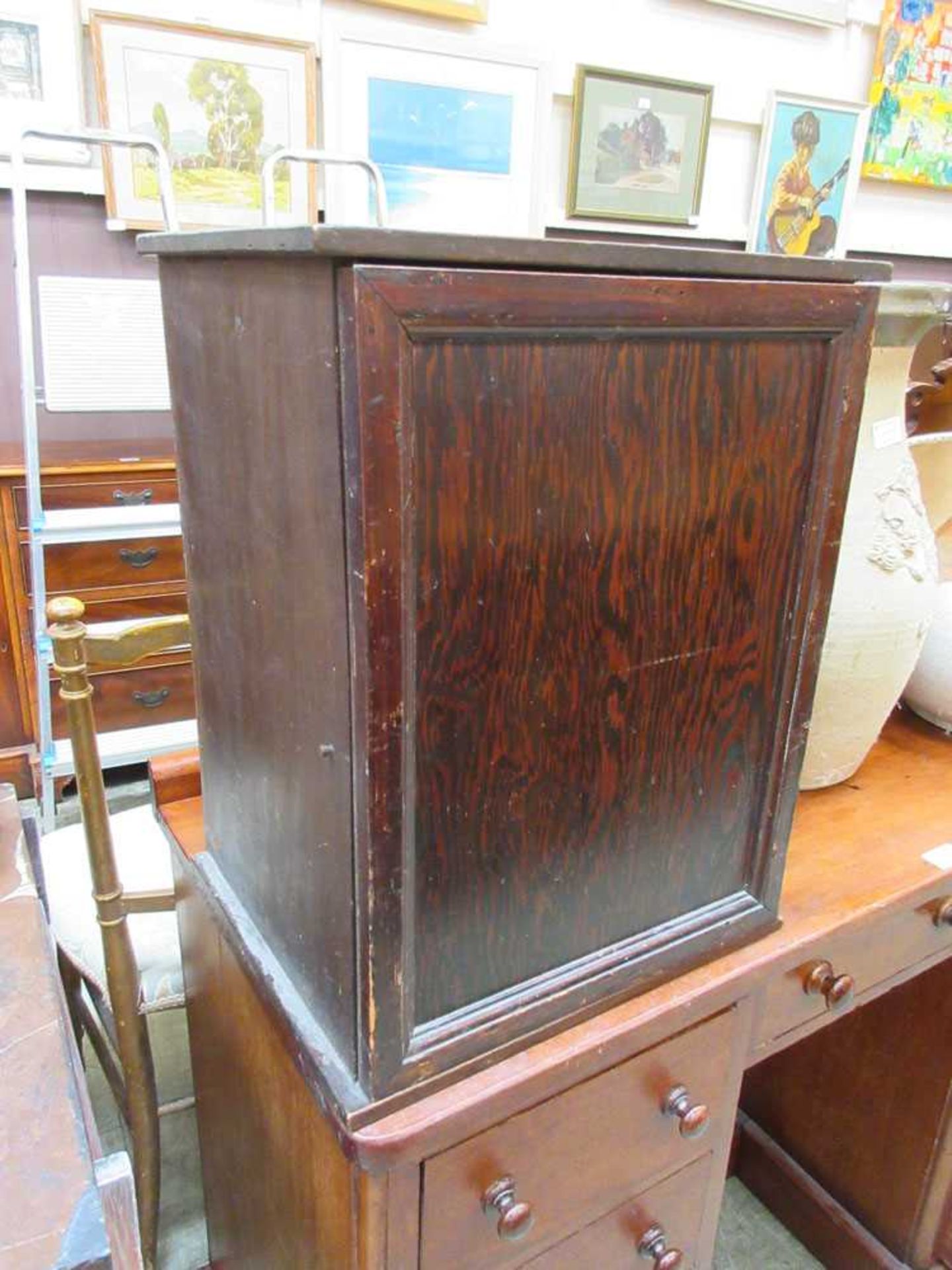 An early 20th century plywood table cabinet