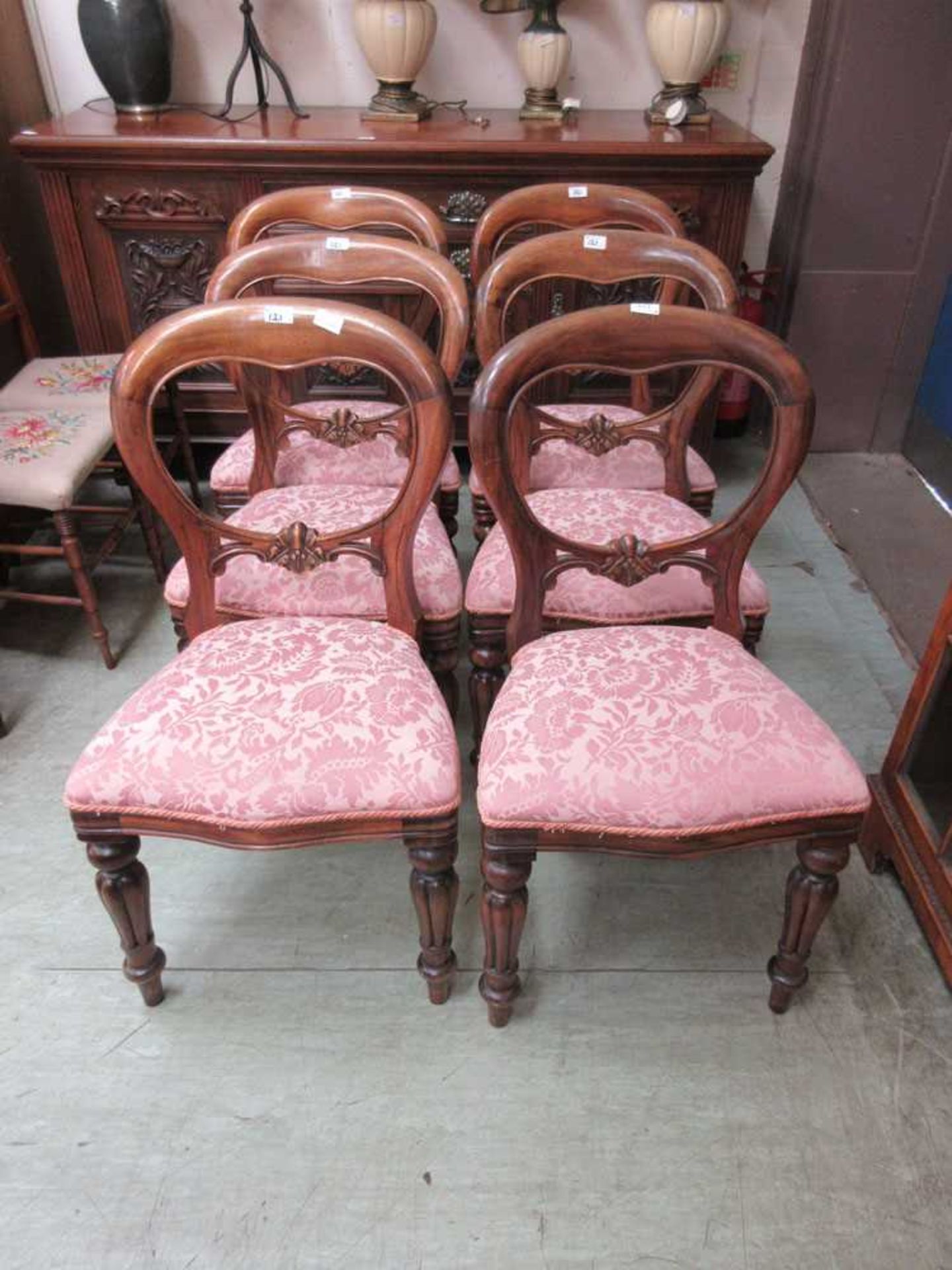 A set of six 19th century style mahogany balloon back dining chairs