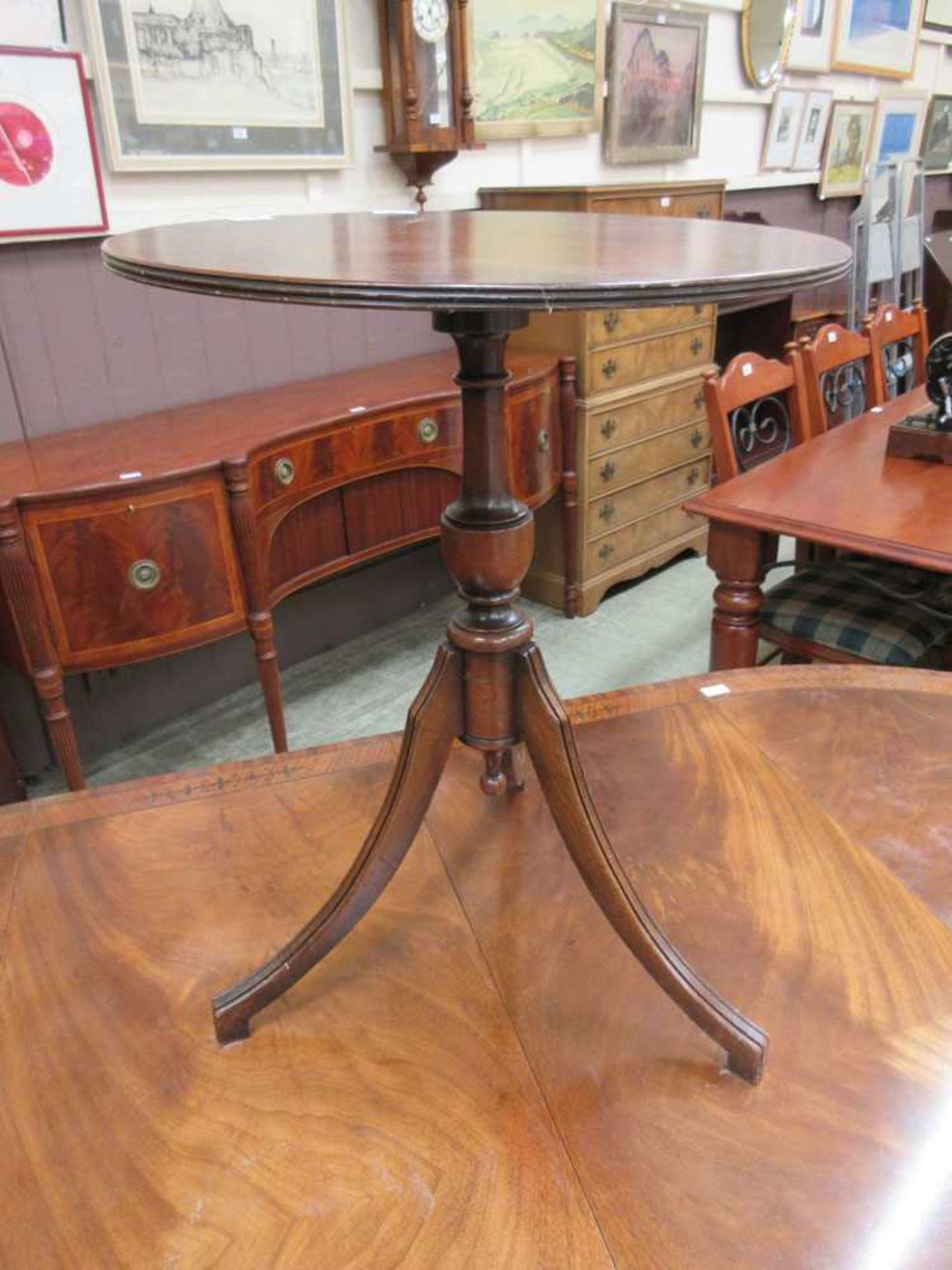 A reproduction mahogany and boxwood strung occasional table