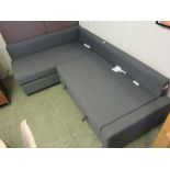 A modern corner sofa upholstered in a grey fabric