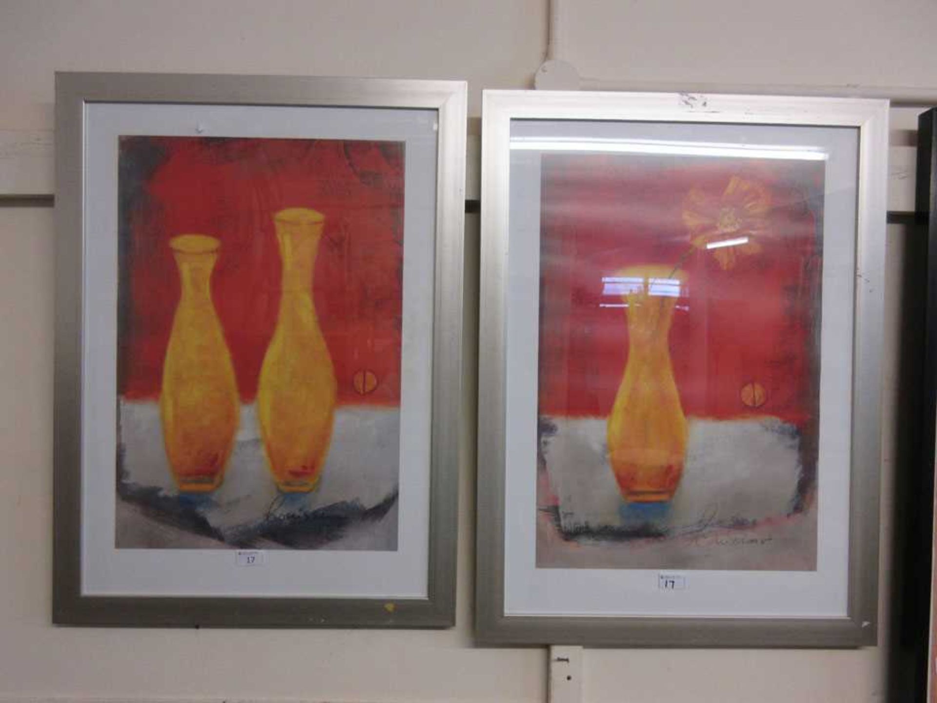 A pair of framed and glazed prints of vases