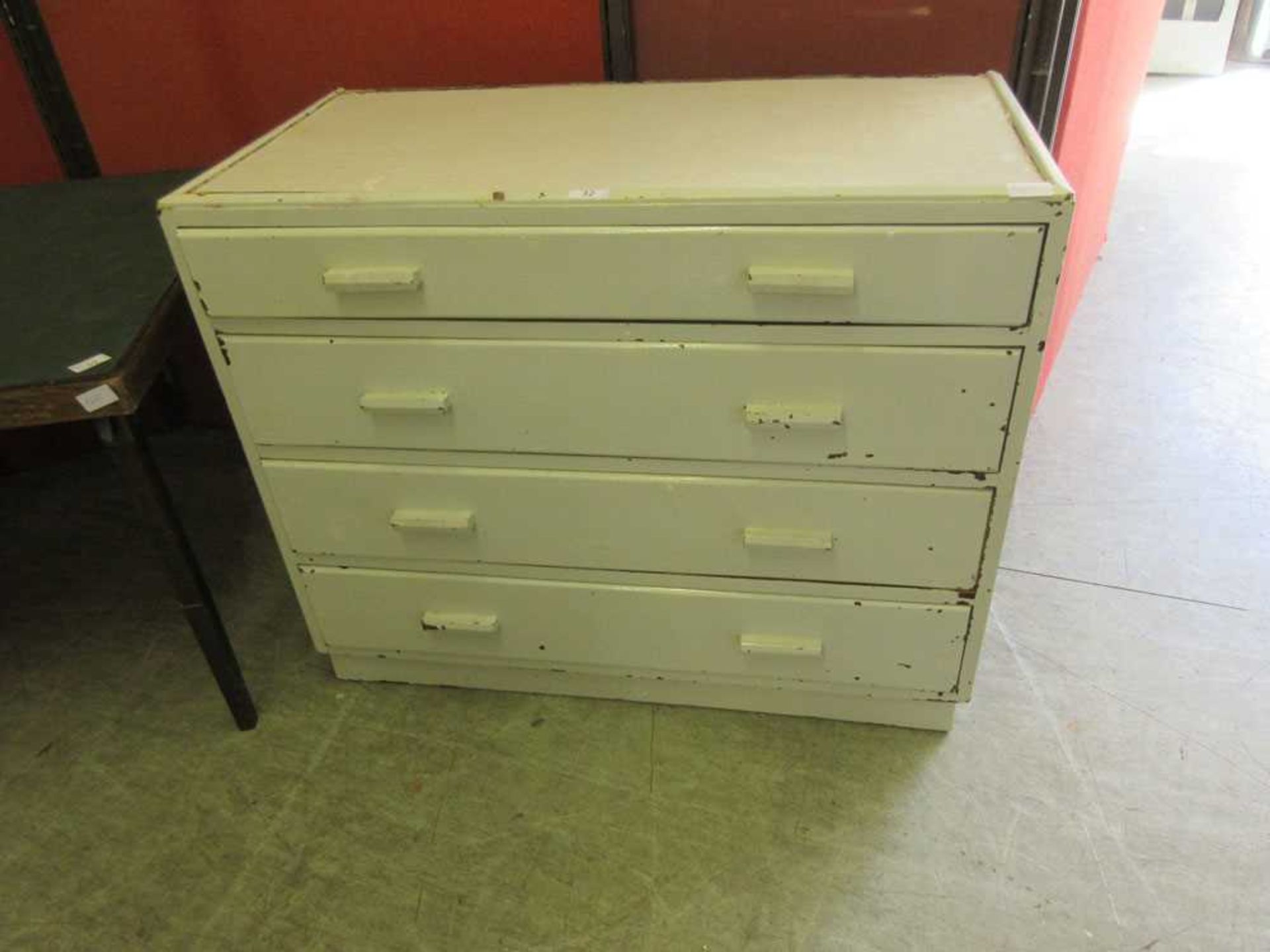 A 20th century white painted four drawer plan chest Dimensions: H, 75cm , W, 91cm , D, 46cm.