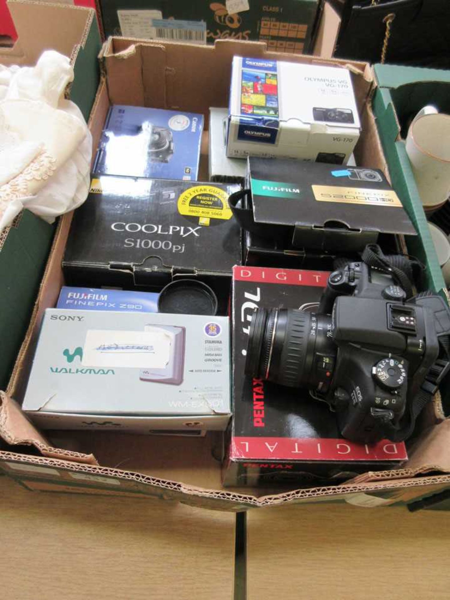 A tray containing a quantity of photographic equipment
