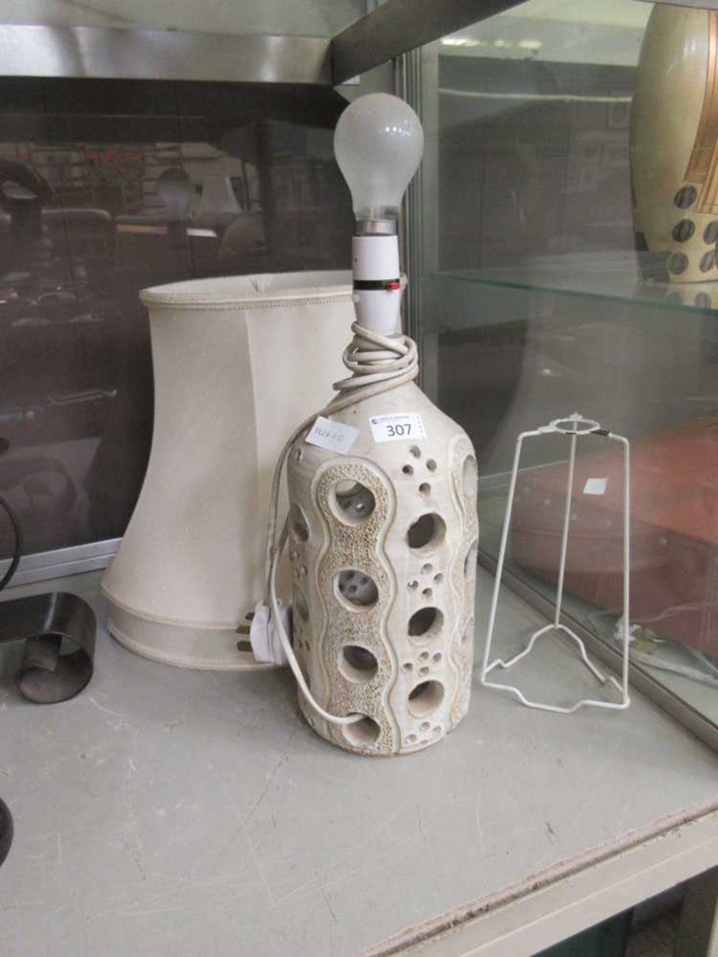 A mid-20th century hand made clay table lamp