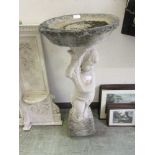 A composite stone bird bath with child column