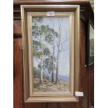 A framed oil on board of trees signed Kerric Miller