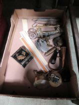 A tray containing an assortment of items to include padlocks, meat jack hooks, horn, etc