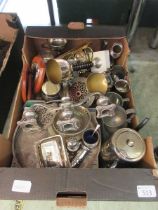 A tray containing a selection of metalware to include candelabra, chalices, shield plaques, etc