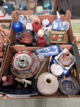 Two trays of mostly ceramic items to include oriental items, plastic figure of two ladies, blue