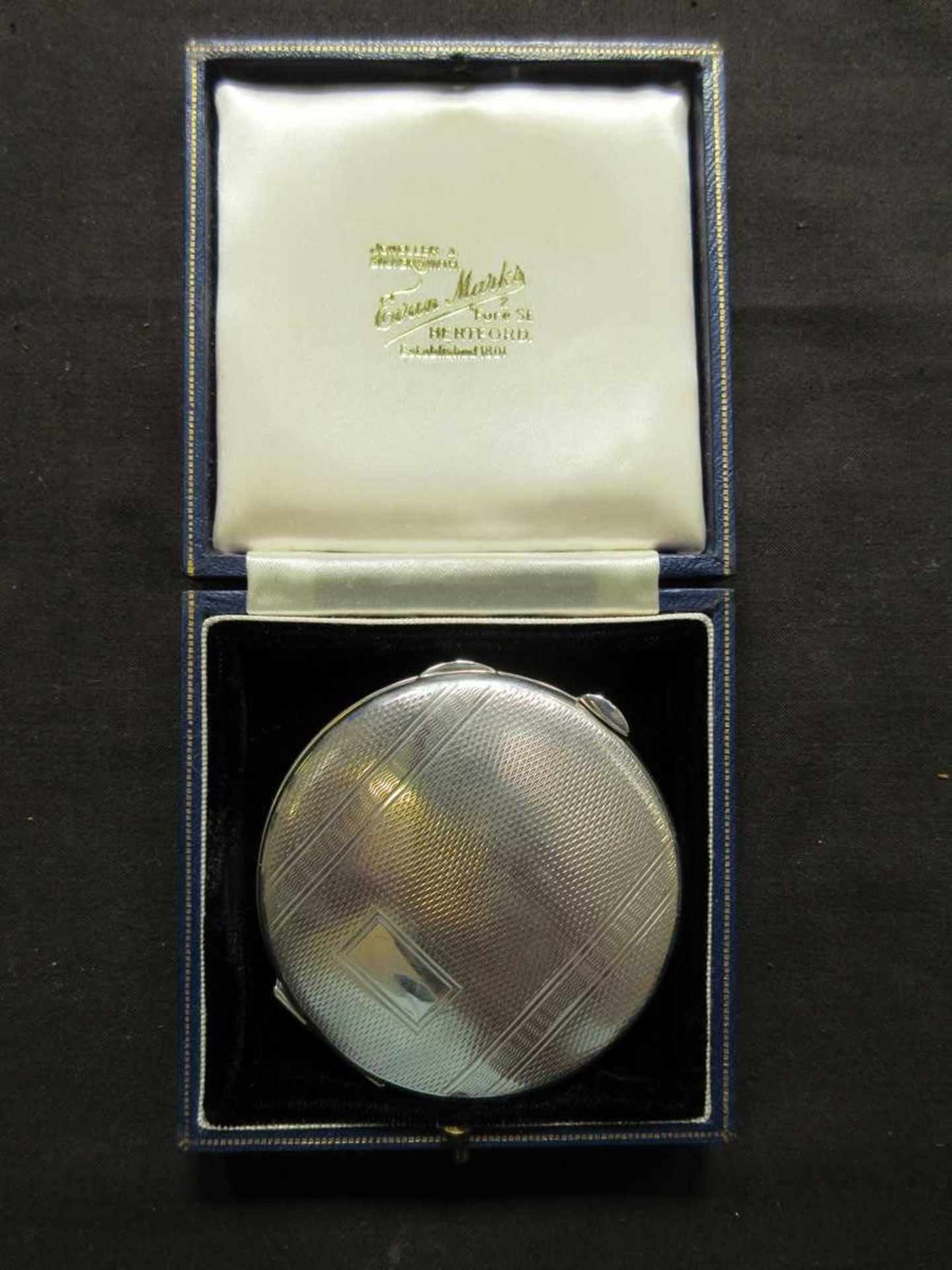 A silver hallmarked compact in box