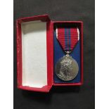 A boxed coronation medal