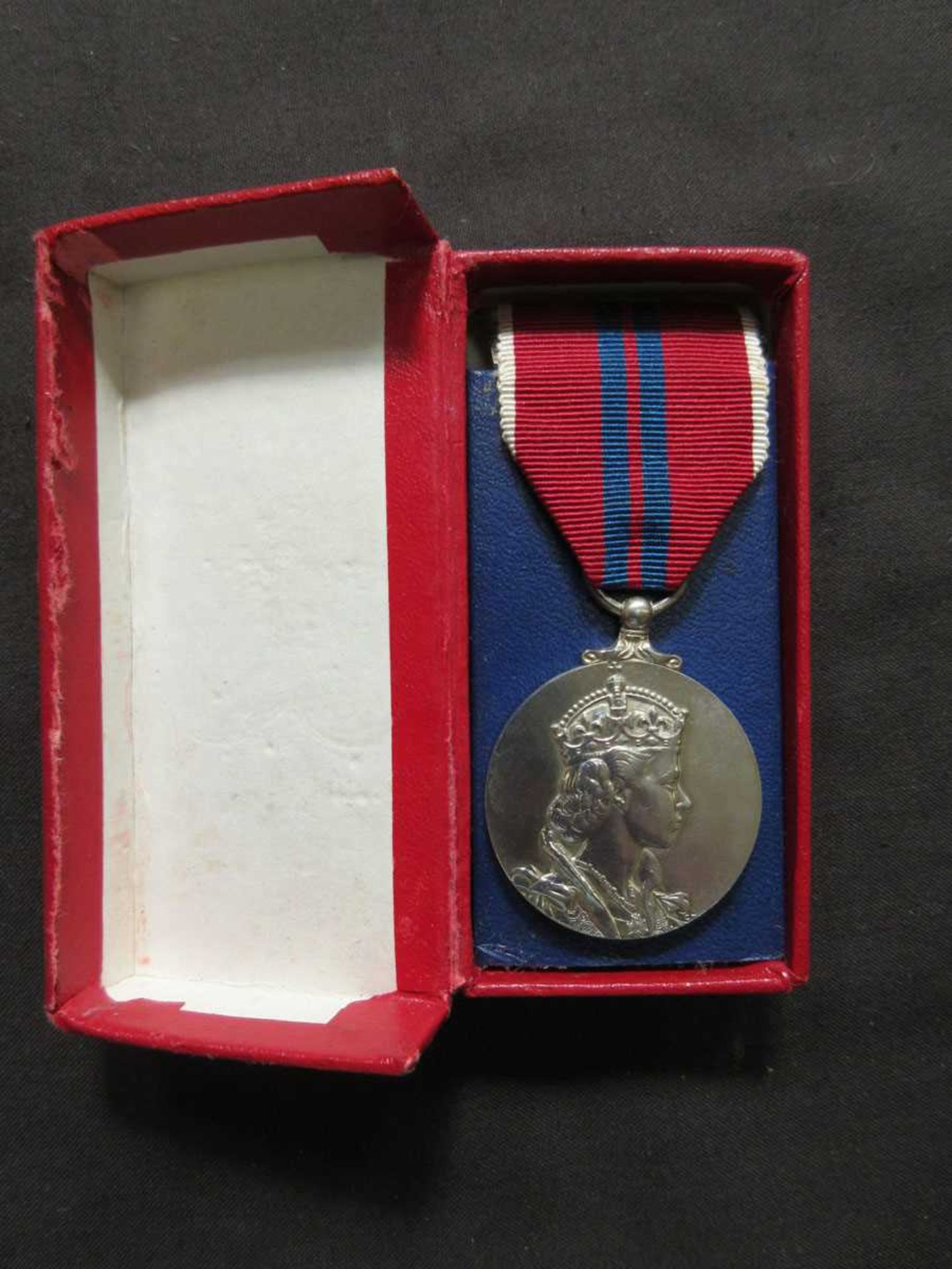 A boxed coronation medal