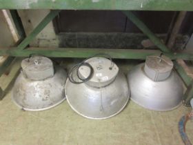 A set of three mid-20th century industrial style ceiling hanging lights