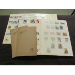 Two stamps albums along with cigarette cards