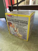 A boxed 'Super Steamer' wallpaper stripper