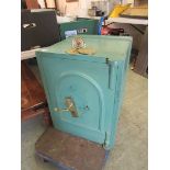 A green painted cast iron safe (A/F)