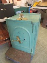 A green painted cast iron safe (A/F)