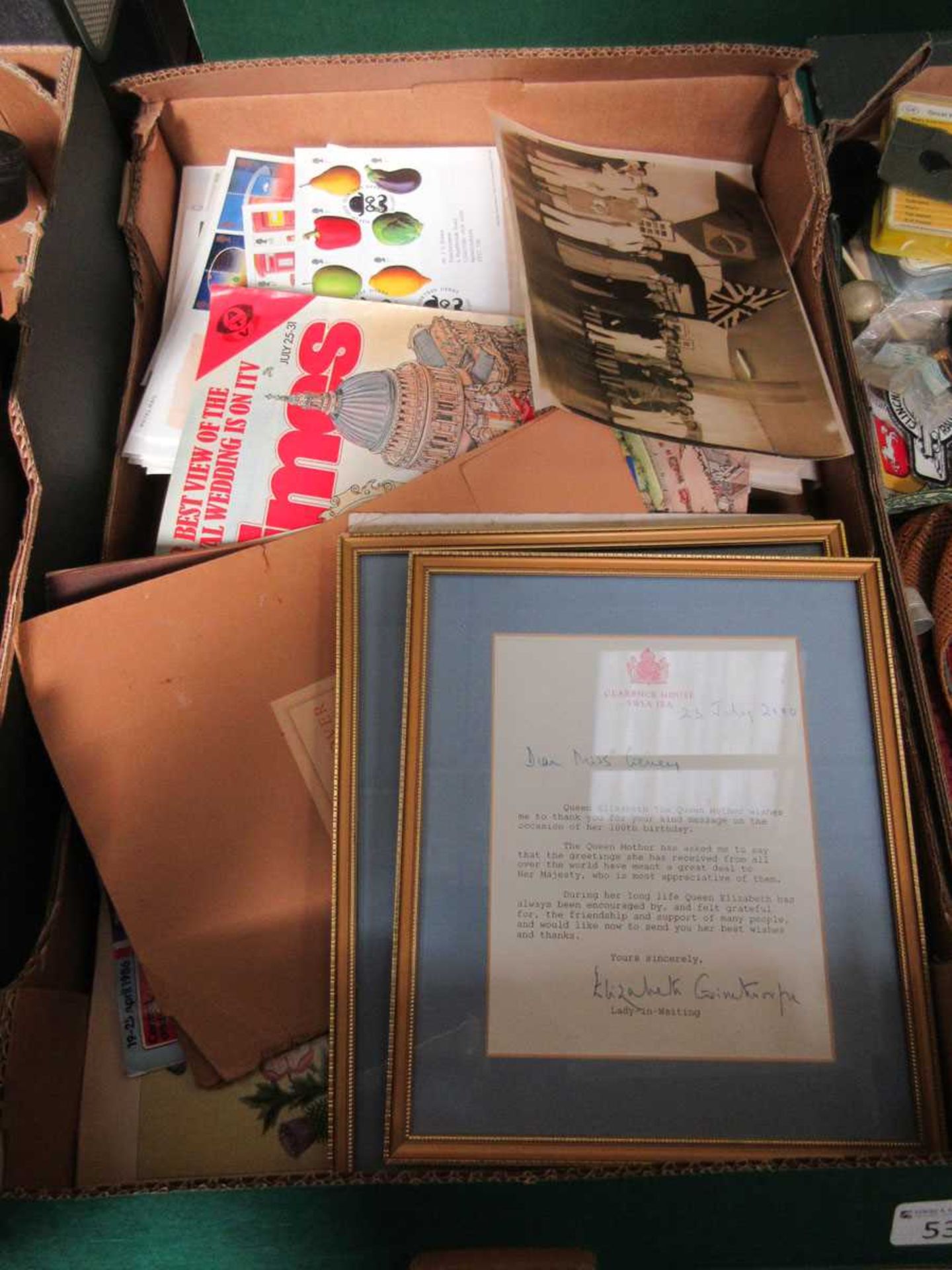 A tray containing a selection of ephemera to include letters from Queen Elizabeth's staff, King