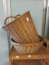 A wicker laundry basket along with a wicker basket