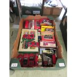 A tray containing a selection of boxed and unboxed die cast vehicles