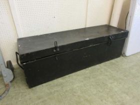 A black painted tin trunk