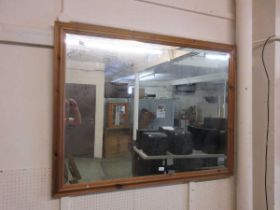A large pine framed bevel glass mirror