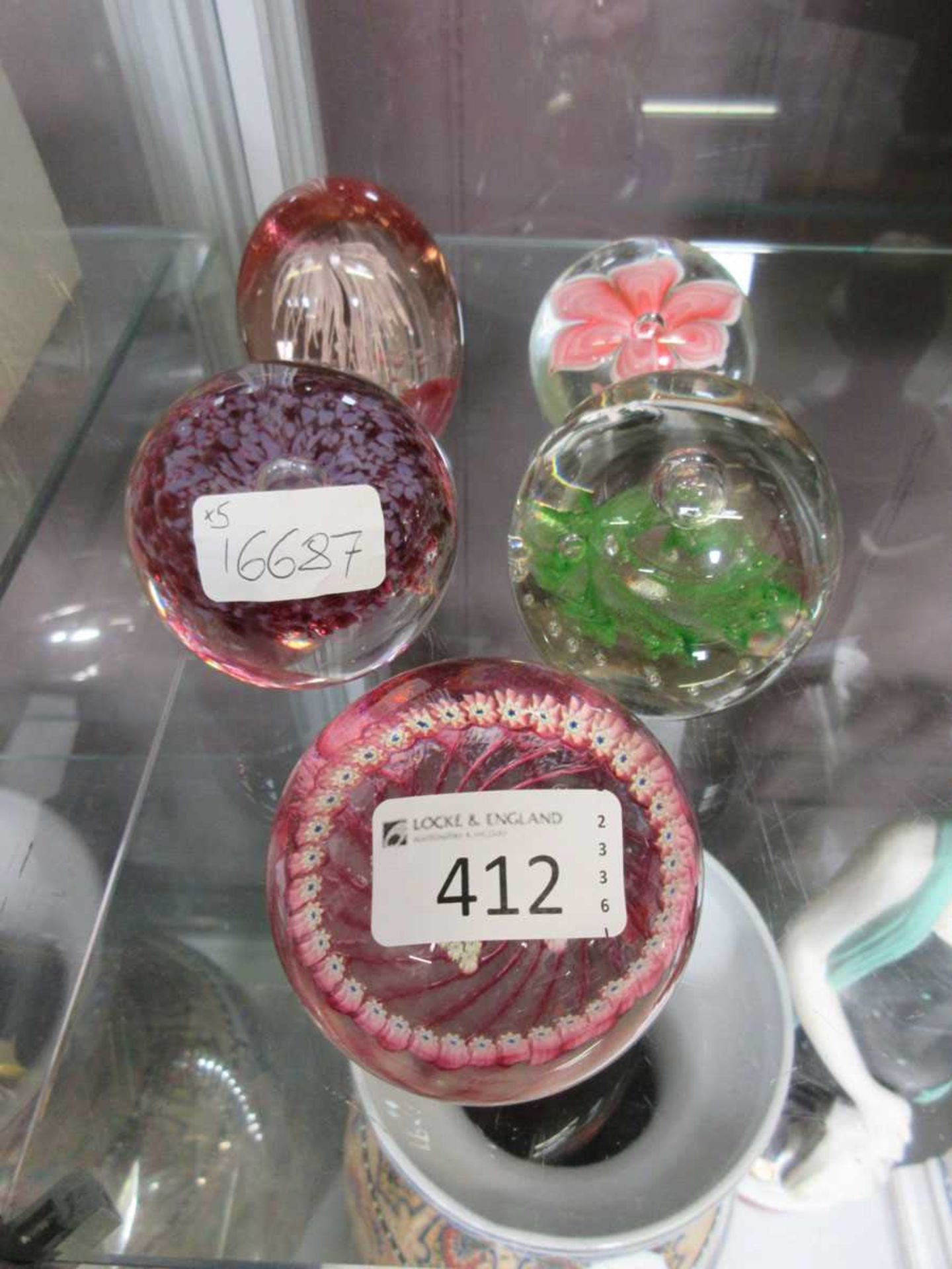 Five glass paperweights