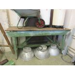 A work bench with green painted base
