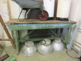 A work bench with green painted base