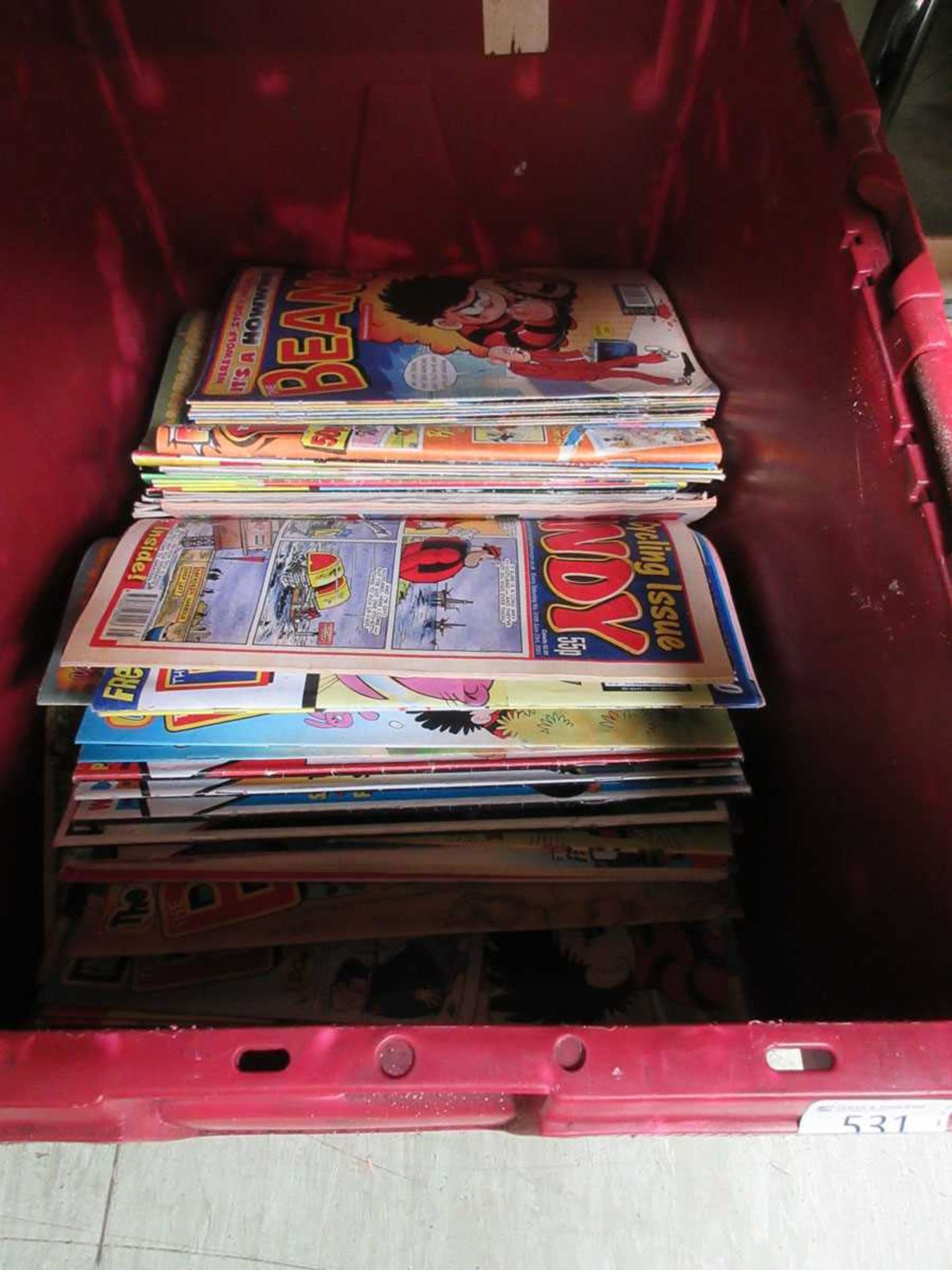 A large PVC box containing comics to include mostly Beano and Dandy