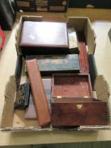 A tray containing a selection of various items to include wooden boxes, cased ruler, etc