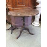 An 18th century oak tilt-top tripod table (A/F)