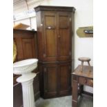 An 18th century oak floor standing corner cupboard Dimensions: H, 203cm ,W, 85cm approx, D, (