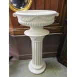 An Italian white ceramic jardiniere on fluted coluimn