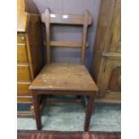 An arts and crafts style oak chair