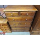 A modern waxed pine chest of two short over four long drawers