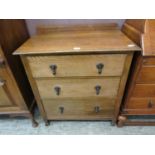 An early 20th century oak chest of three drawers
