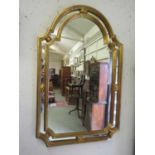 A reproduction gilt framed Regency style mirror