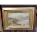 A gilt framed and glazed watercolour of mountainous lake scene, signed bottom left