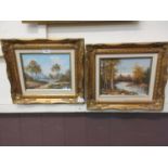 A pair of gilt framed oils on canvas of countryside scenes