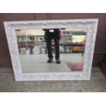 A white framed mirror