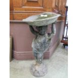 A lead bird bath with putto column Minor knocks and scratches throughout. Chips to edge of bowl,