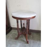 A reproduction Victorian style pedestal table with circular grey marble top