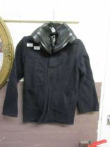 A child's donkey jacket together with a pair of miniature black leather shoes