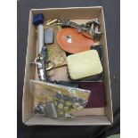 A box containing old razors, 'pistol lighter', etc