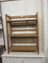 A set of folding wooden book shelves
